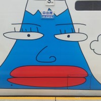 A painting of Mt Fuji on the side of a train