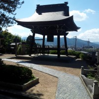 A bell outside a hillside temple in Takayama